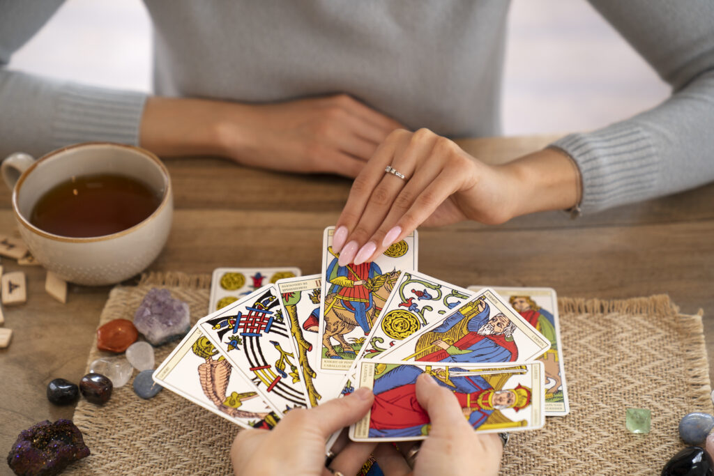 high-angle-woman-reading-tarot